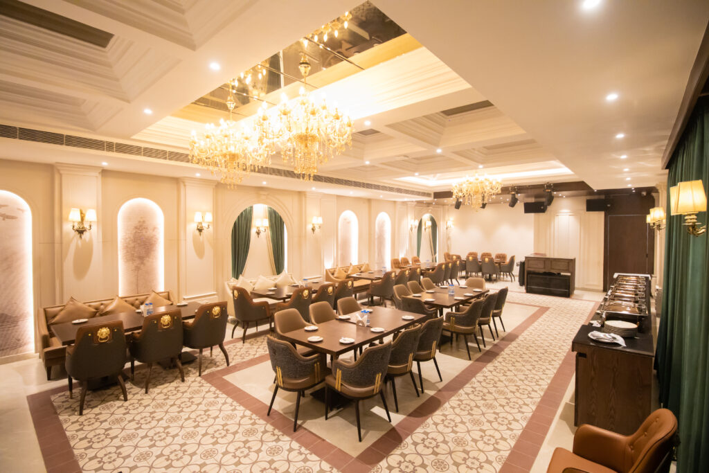 Spacious banquet hall set up for family functions, kitty parties, and corporate meetings.